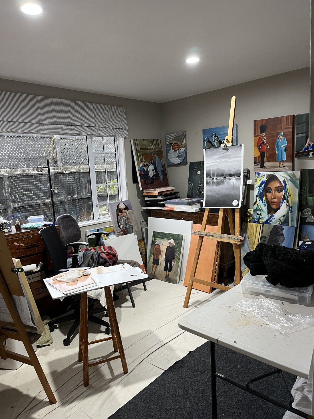 A corner of Ping Burtt's studio, lined with finished and in-progress paintings